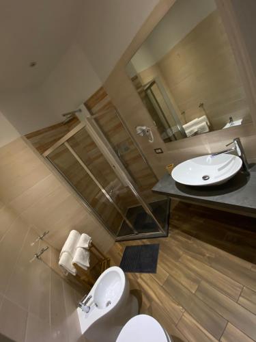 A bathroom at Allegra Suites