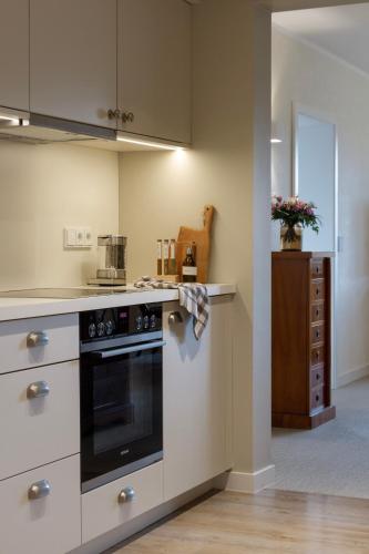 a kitchen with a black and white stove top oven at Gut Moorbeck in Amelhausen