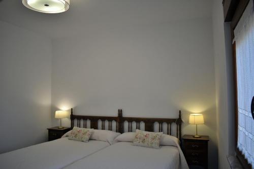 Llit o llits en una habitació de Apartamentos Picea Azul