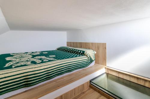 a bed in a room with a glass floor at CASA ADA in Melenara