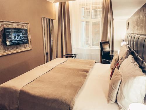Alfons Boutique Hotelにあるベッド