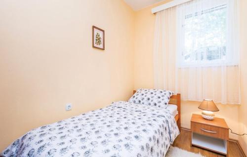 Postel nebo postele na pokoji v ubytování Apartman Marsanic