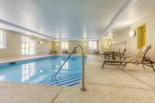 a large swimming pool in a house at Candlewood Suites Mooresville Lake Norman,NC by IHG in Mooresville