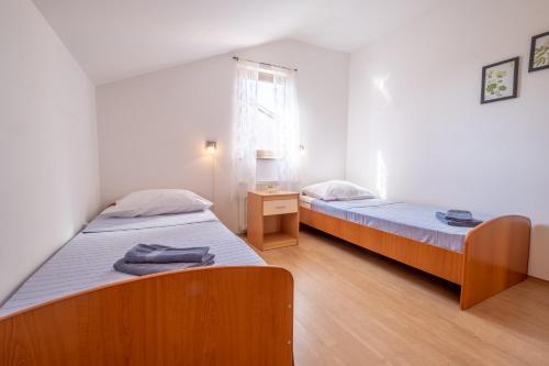 Postel nebo postele na pokoji v ubytování Apartments Irini
