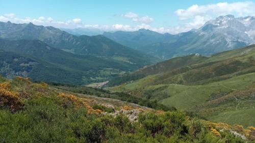 a view of a valley with mountains in the background at Casa Rural Burón in Posada de Valdeón