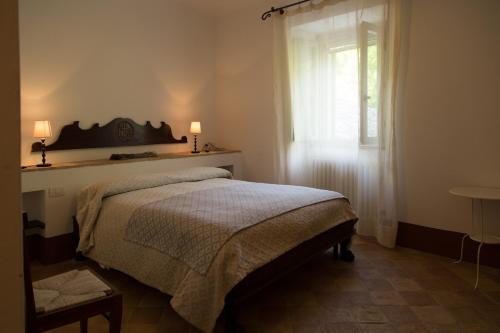 En eller flere senge i et værelse på FonteAntica Agriturismo