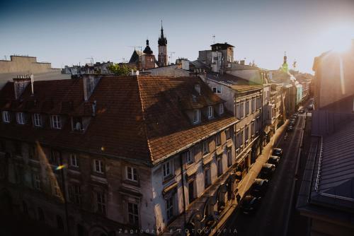an overhead view of a city with buildings at Saint Thomas Corner in Krakow