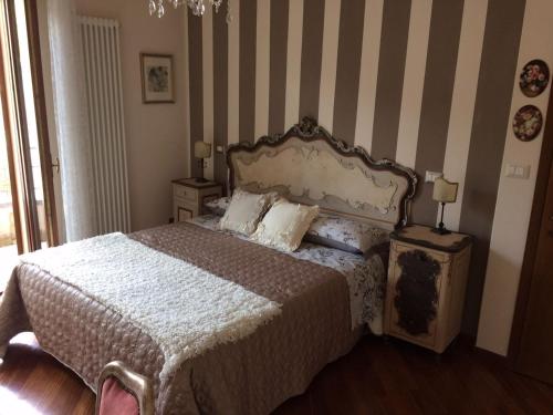 Postel nebo postele na pokoji v ubytování CASA LE ROSE