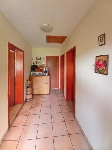 a hallway of a house with a tile floor at Vikendica Vlahić, Goranci in Mostar