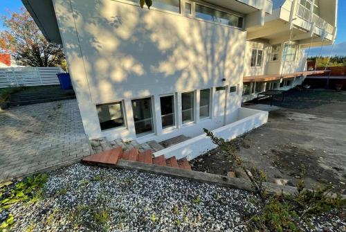 a building with a bunch of windows on the side of it at Cozy centrally located apartment in Reykjavik in Reykjavík