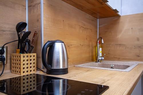 a kitchen with a coffee maker on a counter at Lucky Jet in Novosibirsk