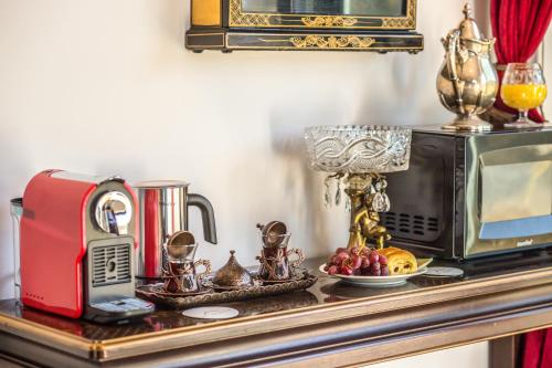 a table with a toaster and a microwave on it at Quiet Mind Mountain Lodge, Retreat & Spa in Julian
