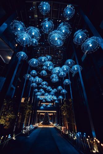a room with christmas lights and a christmas tree at Cheery Dragon Canal Hotel Hangzhou - Intangible Cultural Heritage Hotel in Hangzhou