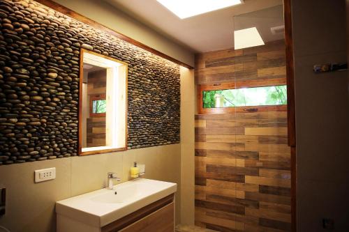 a bathroom with a sink and a mirror at Wings of Tatev Private Villa in Halidzor