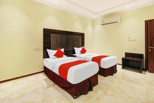 Ένα ή περισσότερα κρεβάτια σε δωμάτιο στο Al Tamayoz Al Raqi - Hiraa