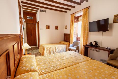 Cama o camas de una habitación en Hostal Loreto