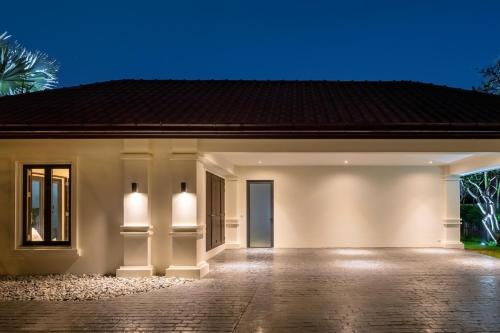 a rendering of a house at night at Luxury 5 Bedroom Pool Villa B11B in Hua Hin