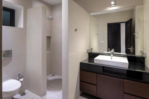 a bathroom with a sink and a toilet at Luxury 5 Bedroom Pool Villa B11B in Hua Hin
