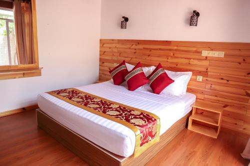 Ένα ή περισσότερα κρεβάτια σε δωμάτιο στο New Breeze Thoddoo Inn