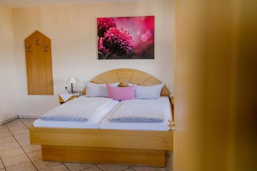 Postel nebo postele na pokoji v ubytování Hotel Vogtareuther-Hof