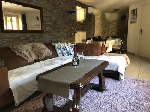 a living room with a couch and a table at La Villa - Beach house & Rooms in Crikvenica