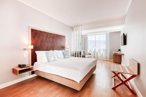 Кровать или кровати в номере Vila Baleira Funchal