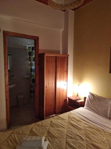 Ένα ή περισσότερα κρεβάτια σε δωμάτιο στο Elatos Rooms
