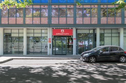 a car parked in front of a building at Appart'City Classic Bordeaux Centre in Bordeaux