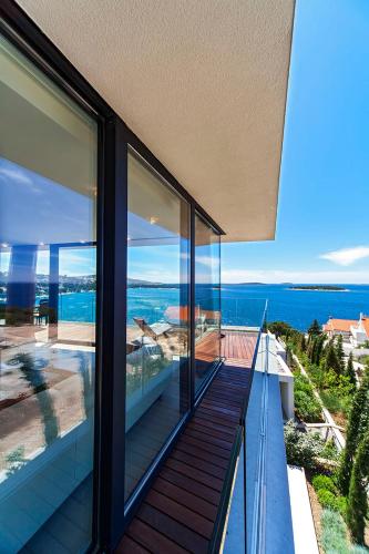 a house with a view of the ocean at Golden Rays Luxury Villas & Apartments in Primošten