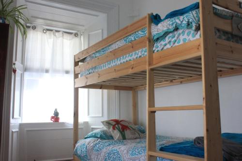 a bunk bed in a bedroom with a bunk bedutenewayangering at Johnston House: Historic Village Retreat in Kinvara