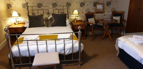 Ein Bett oder Betten in einem Zimmer der Unterkunft The Spread Eagle Hotel