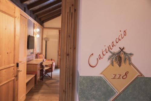 a room with a sign that reads california at Hotel Rubino Deluxe in Campitello di Fassa