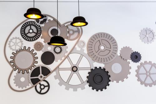 an illustration of a bunch of gears at VISIONAPARTMENTS Rue de Berne - contactless check-in in Geneva
