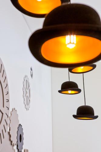 a group of lights hanging from a wall at VISIONAPARTMENTS Rue de Berne - contactless check-in in Geneva