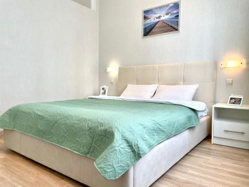 NAVIT luxury apartments with breakfast near the railway station, the city center and the park tesisinde bir odada yatak veya yataklar