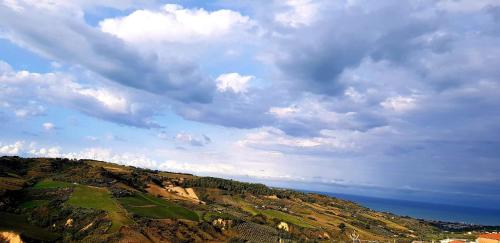 a view of a mountain under a cloudy sky at B&B Palazzo Mestichelli Boutique Palace in Monteprandone