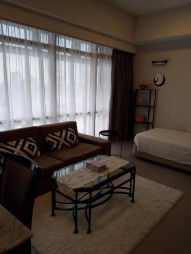 a living room with a couch and a coffee table at Fantastic appartment at times square Kuala Lumpur in Kuala Lumpur