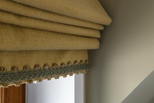 a curtain on a window in a room at Dunnet B&B Escapes in Dunnet