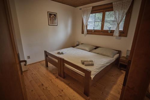 Кровать или кровати в номере Chata Vŕšky Terchová