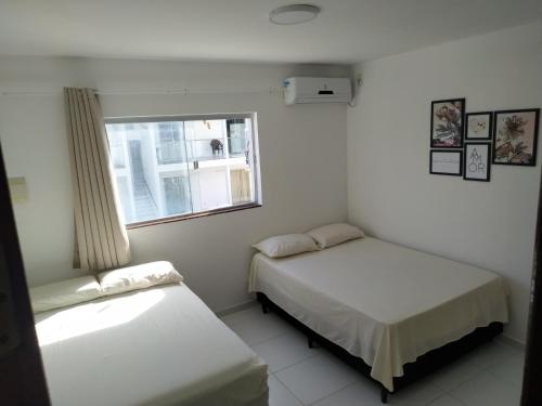Ένα ή περισσότερα κρεβάτια σε δωμάτιο στο Apartamento VISTA MAR - Condomínio Granito e Jasmim