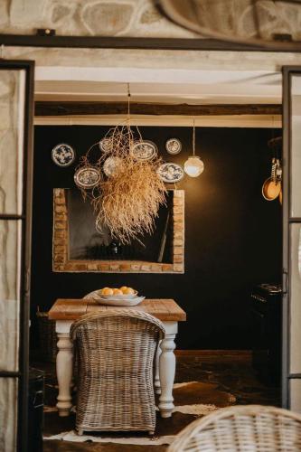 a dining room with a table and a chandelier at Twyfelberg Karoo Hideaway in Britstown
