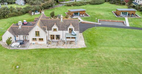 an aerial view of a large house at Dunnet B&B Escapes in Dunnet
