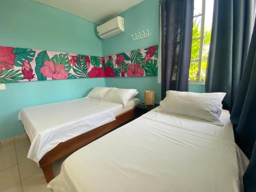Cama o camas de una habitación en MAHALO HOUSE B&B - Tu Casa Hospedaje en San Andrés Isla -