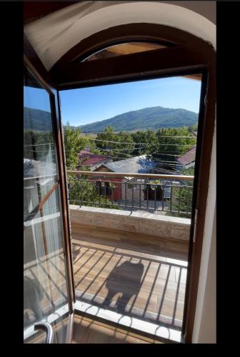 a view from a window of a balcony with a view at Bujtina Liana Voskopoje in Voskopojë