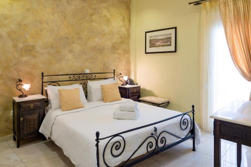 a bedroom with a large bed and a window at Marble House in Athens