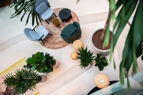 an overhead view of a living room with furniture and plants at Radisson Blu Resort & Spa in Split