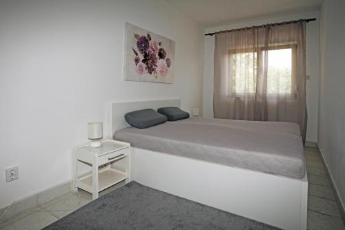Postel nebo postele na pokoji v ubytování Apartments Zeljko