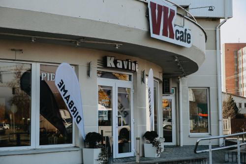 a store with a surfboard in the front of it at Verslo Klasė-easy to stay in Panevėžys