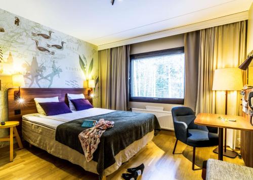מיטה או מיטות בחדר ב-Scandic Gävle Väst