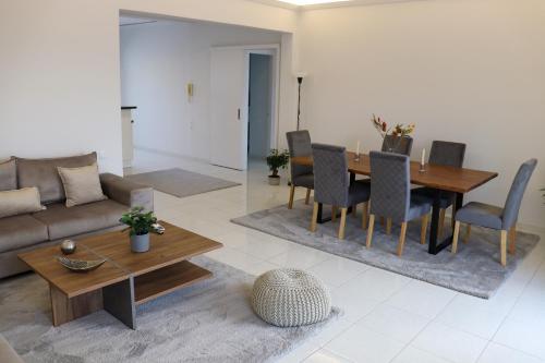 a living room with a couch and a table at Superior Double Room with Stunning Sea View. DT in Patra
